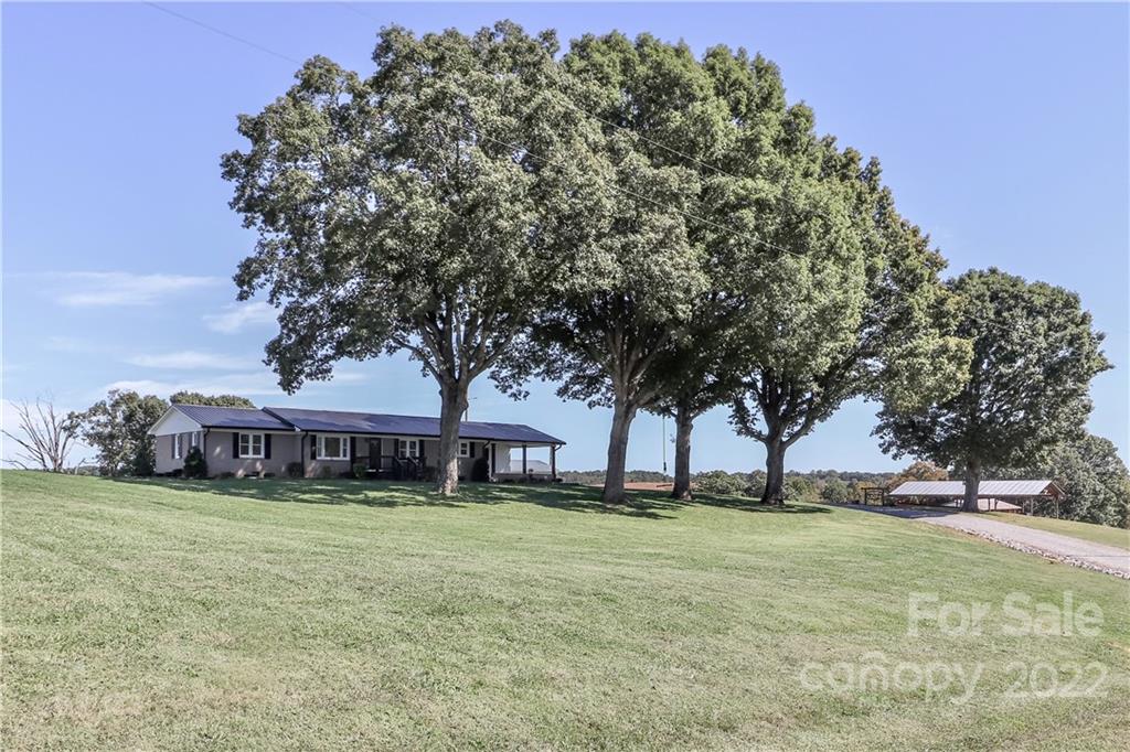 147 Stack Road Olin, NC 28660 - Photo 5 of 47 a view of swimming pool with outdoor seating and trees