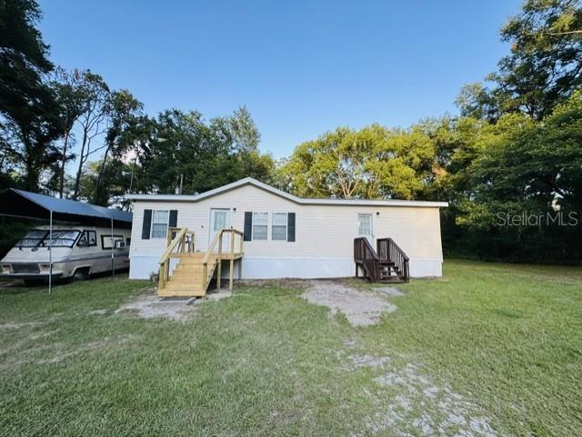 11817 Southwest 58th Street Webster, FL 33597 - Photo 1 of 46 a view of a house with backyard