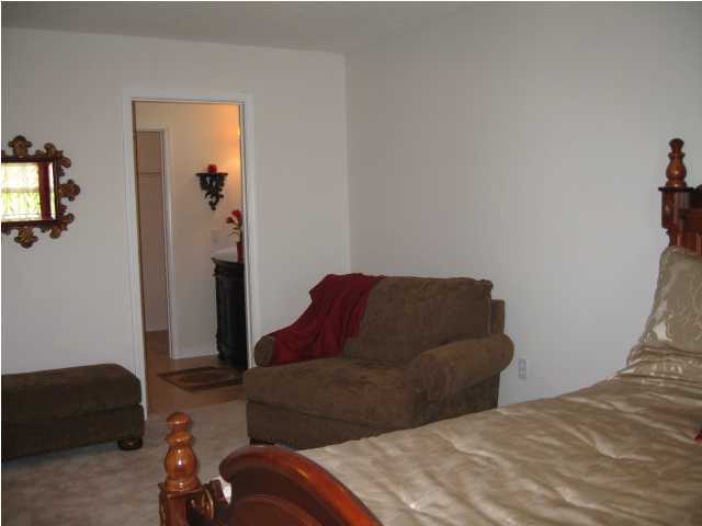 5214 Moore Loop Crestview, FL 32536 - Photo 12 of 13 a bedroom with a bed and a couch