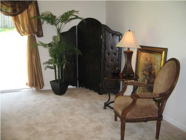5214 Moore Loop Crestview, FL 32536 - Photo 3 of 13 a view of entryway with wooden floor