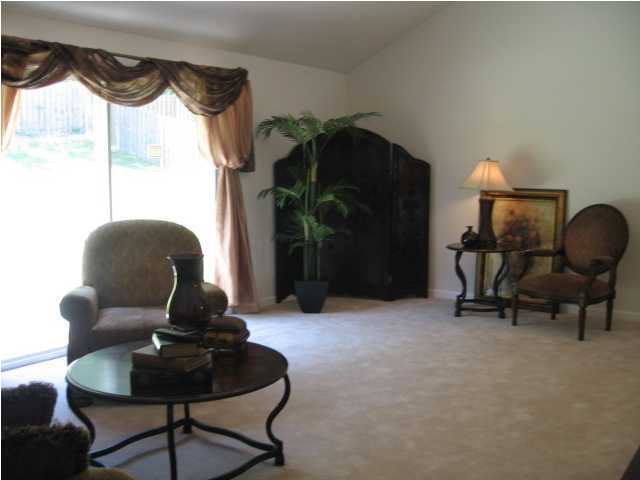 5214 Moore Loop Crestview, FL 32536 - Photo 5 of 13 a living room with furniture and a potted plant
