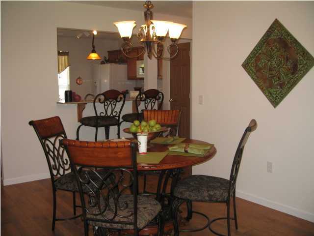 5214 Moore Loop Crestview, FL 32536 - Photo 6 of 13 a view of a dining room with furniture and chandelier
