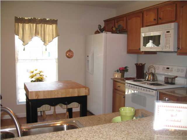 5214 Moore Loop Crestview, FL 32536 - Photo 8 of 13 a kitchen with a sink cabinets and window