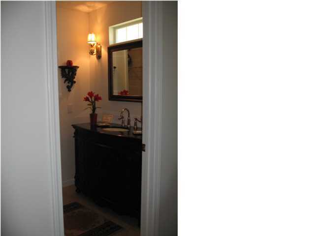 5214 Moore Loop Crestview, FL 32536 - Photo 10 of 13 a bathroom with a sink and a mirror