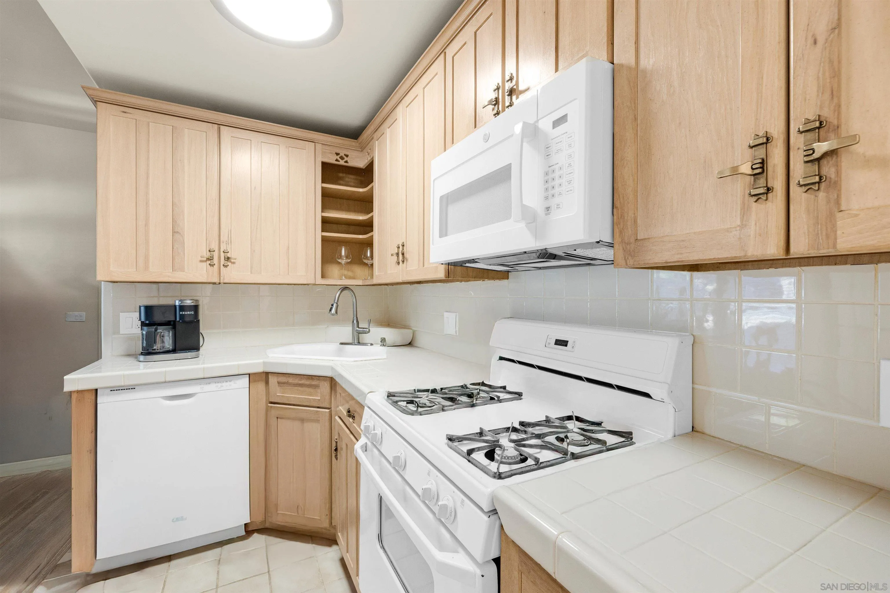 2015 2nd Street, Unit 2015 Julian, CA 92036 - Photo 3 of 11 a kitchen with stainless steel appliances cabinets and a window