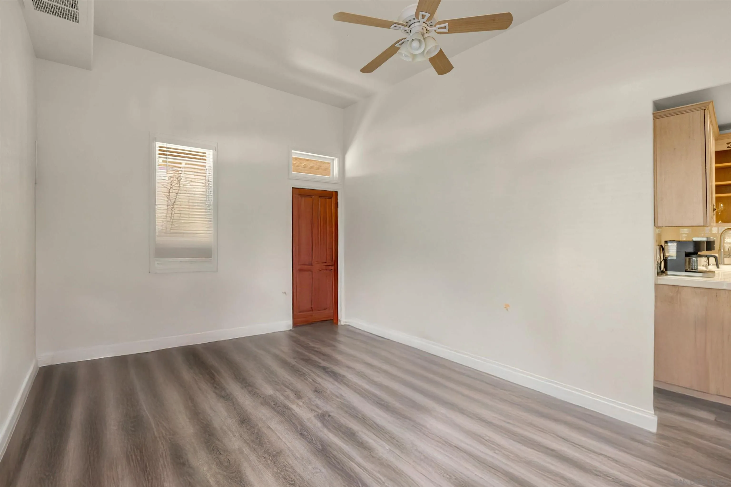 2015 2nd Street, Unit 2015 Julian, CA 92036 - Photo 4 of 11 a view of an empty room with wooden floor and a window