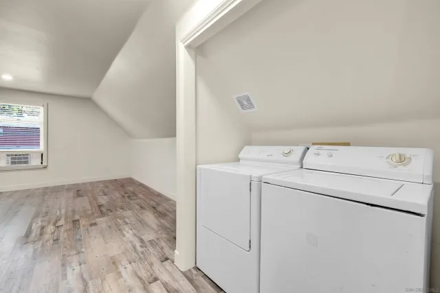 a view of storage and utility room with washer and dryer