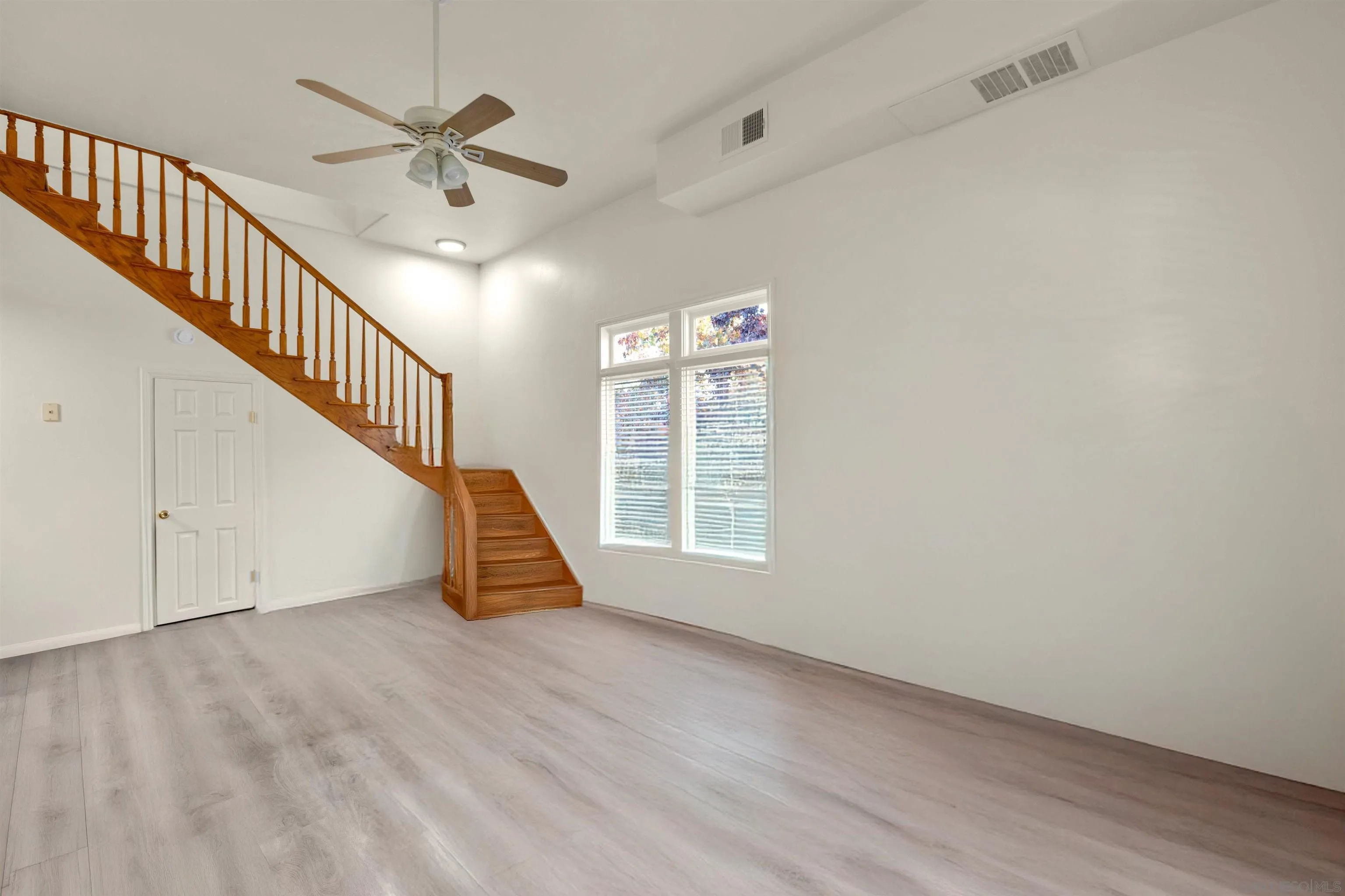 2015 2nd Street, Unit 2015 Julian, CA 92036 - Photo 7 of 11 a view of an empty room with wooden floor and a window