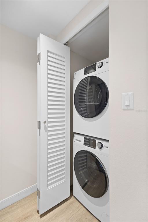 240 Sands Point Road, Unit 4104 Longboat Key, FL 34228 - Photo 22 of 47 a utility room with dryer and washer