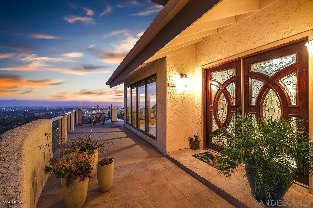 1778 Kings Road Vista, CA 92084 - Photo 18 of 49 a view of a balcony with couches and potted plants