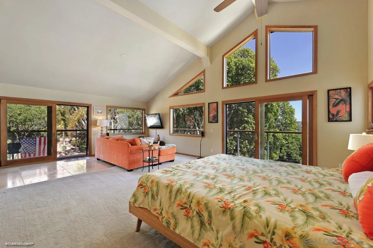 1778 Kings Road Vista, CA 92084 - Photo 25 of 49 a bed sitting in a bedroom next to a window