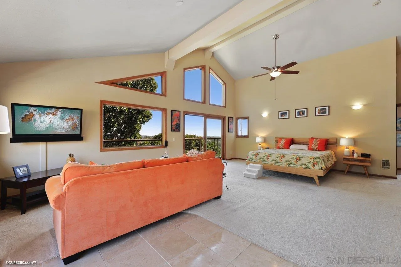 1778 Kings Road Vista, CA 92084 - Photo 26 of 49 a bed room with furniture and a ceiling fan