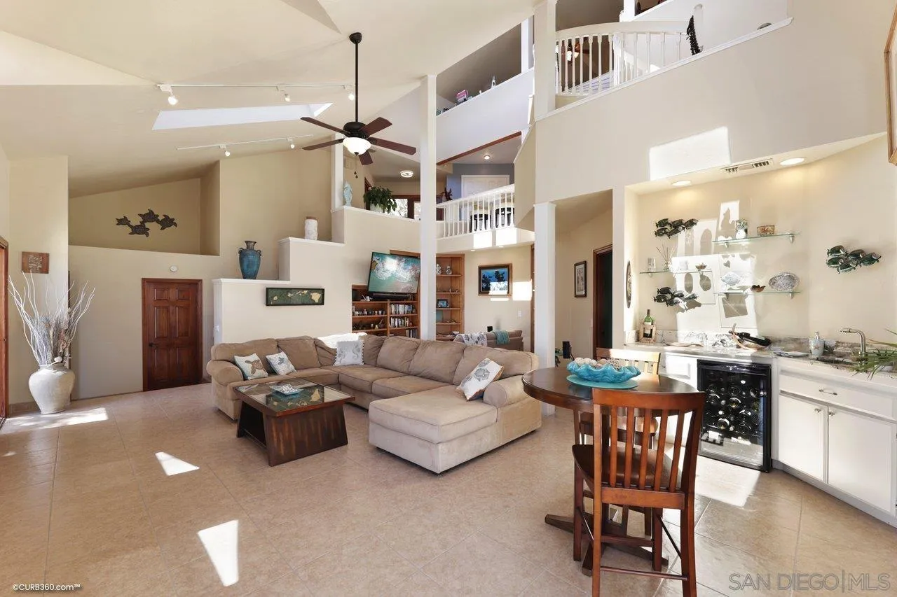 1778 Kings Road Vista, CA 92084 - Photo 29 of 49 a living room with furniture kitchen view and a chandelier