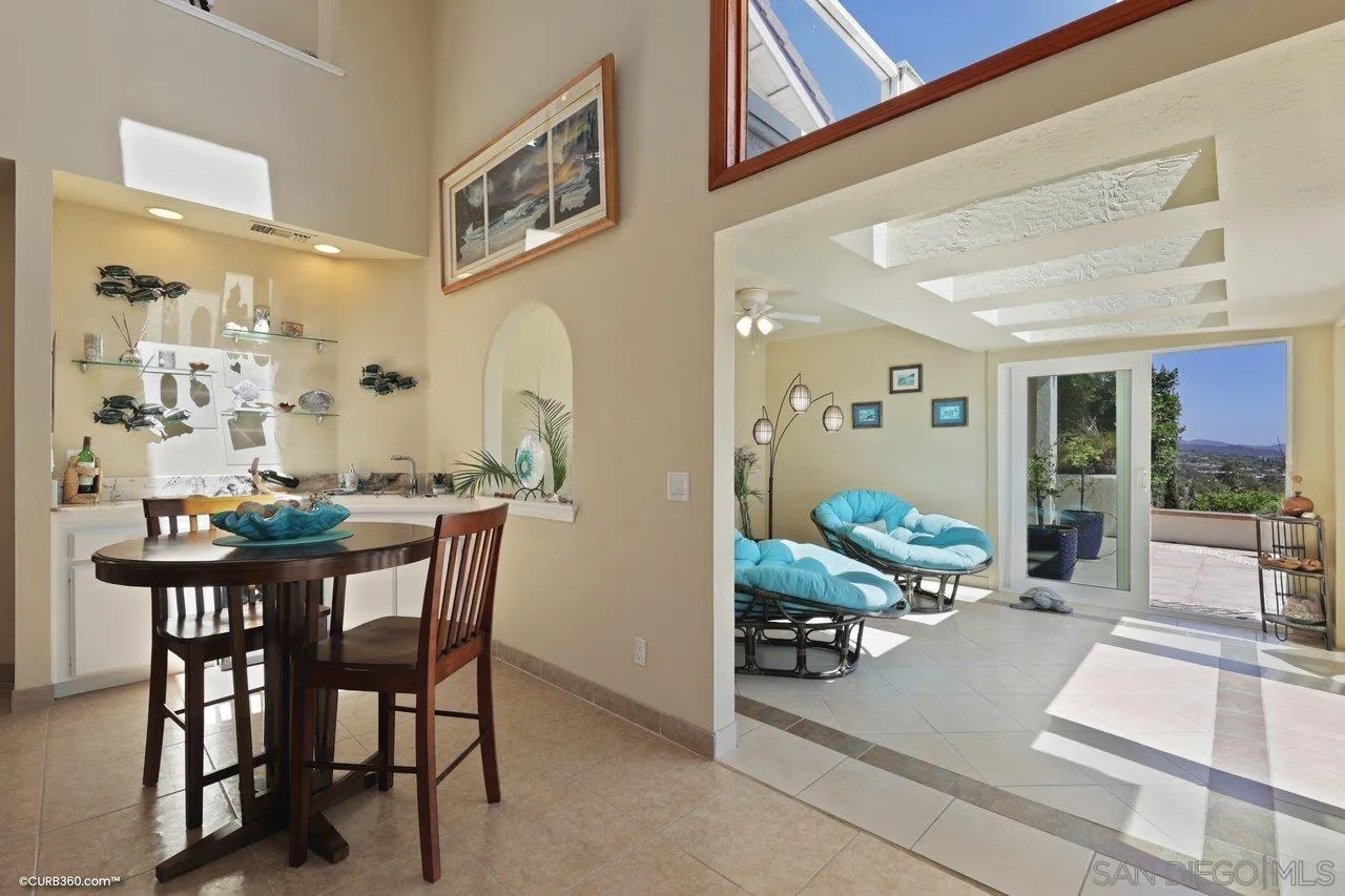 1778 Kings Road Vista, CA 92084 - Photo 30 of 49 a view of a dining room with furniture and a potted plant