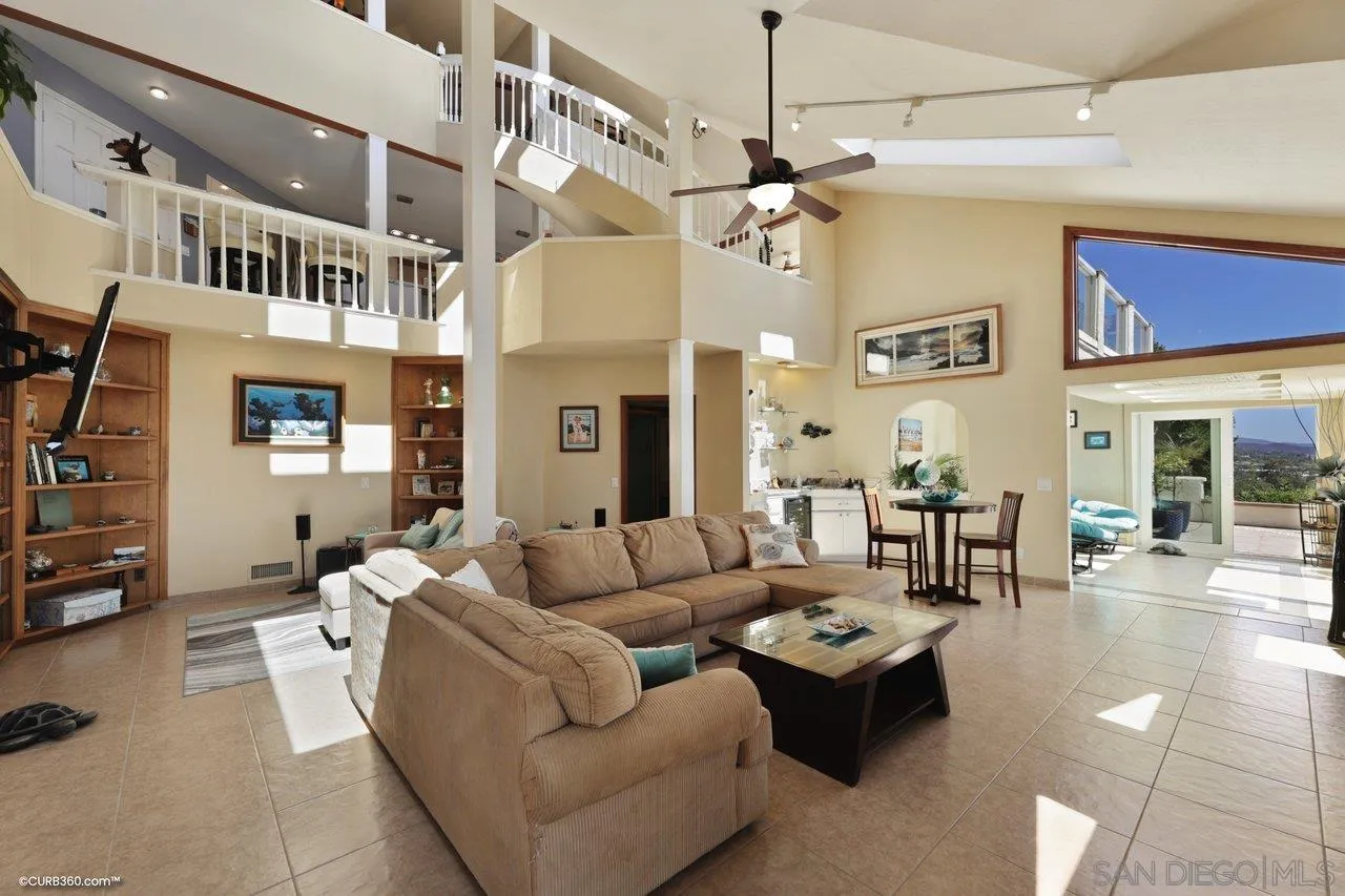 1778 Kings Road Vista, CA 92084 - Photo 32 of 49 a living room with furniture a chandelier and a dining table