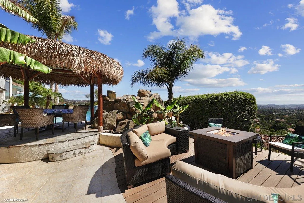 1778 Kings Road Vista, CA 92084 - Photo 34 of 49 a view of a terrace with couches and a fire pit and a fire pit