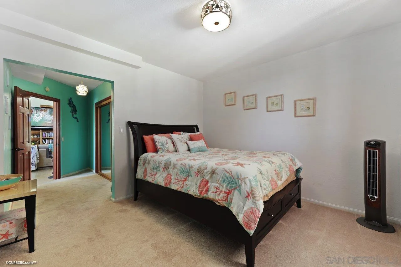 1778 Kings Road Vista, CA 92084 - Photo 44 of 49 a bed sitting in a bedroom next to a window