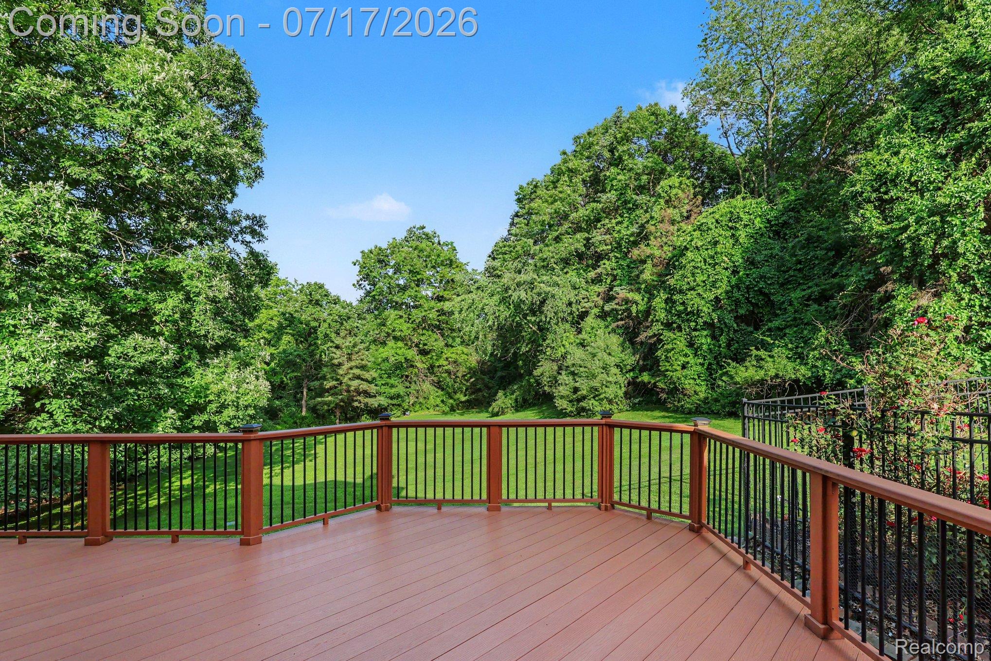5685 Paint Valley Drive Rochester, MI 48306 - Photo 37 of 66 Curved outdoor deck featuring composite decking and black metal railings