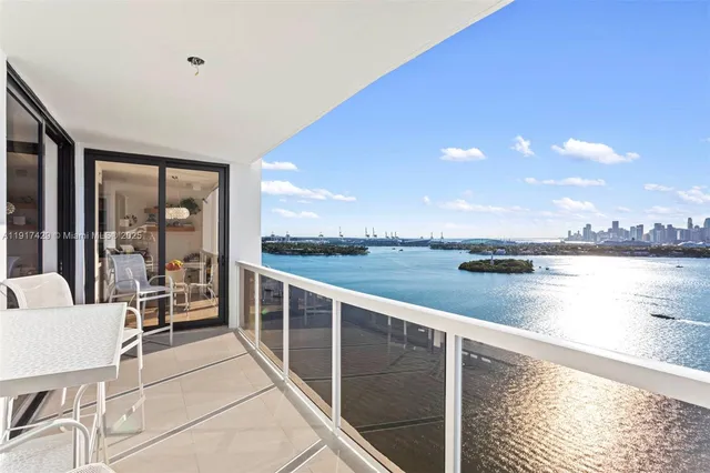 a view of a balcony with lake view and mountain view