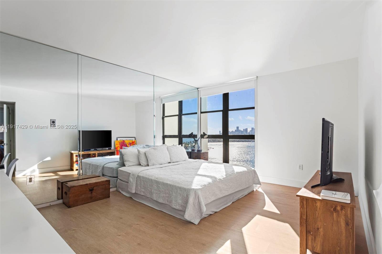 9 Island Avenue, Unit 2006 Miami Beach, FL 33139 - Photo 16 of 24 a living room with furniture and a flat screen tv
