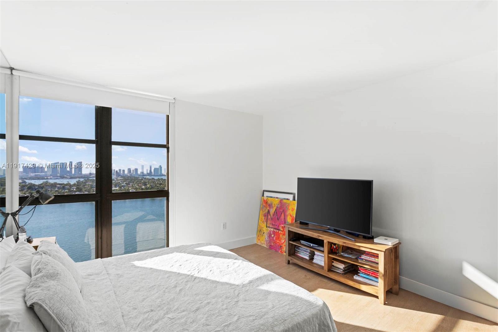 9 Island Avenue, Unit 2006 Miami Beach, FL 33139 - Photo 18 of 24 a bedroom with a bed and a flat screen tv