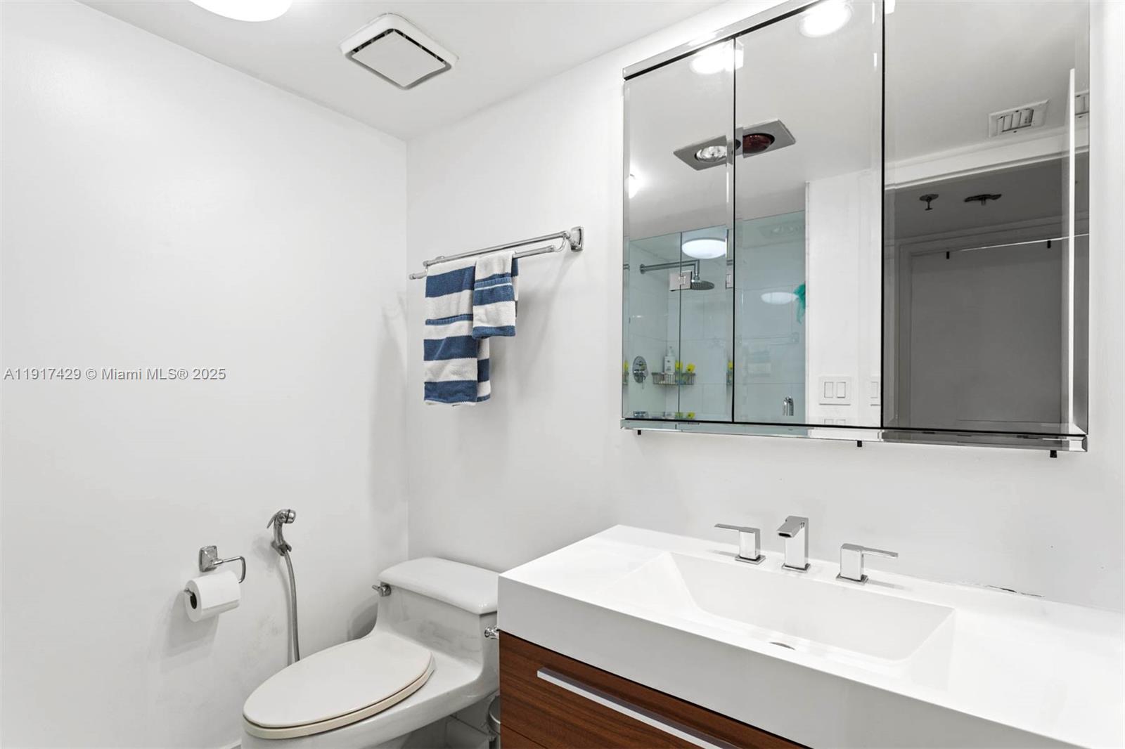 9 Island Avenue, Unit 2006 Miami Beach, FL 33139 - Photo 21 of 24 a bathroom with a sink toilet and shower