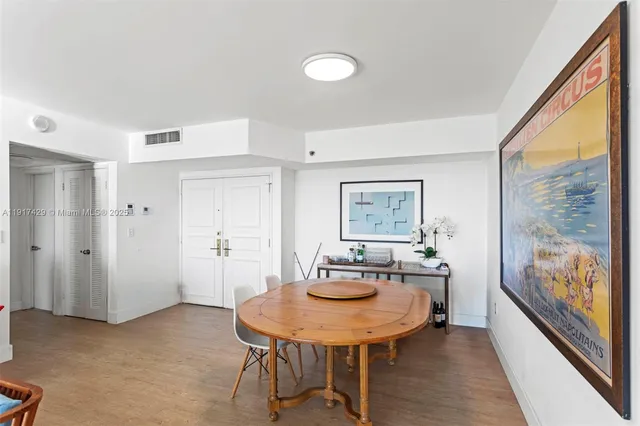 a view of a room with furniture and window