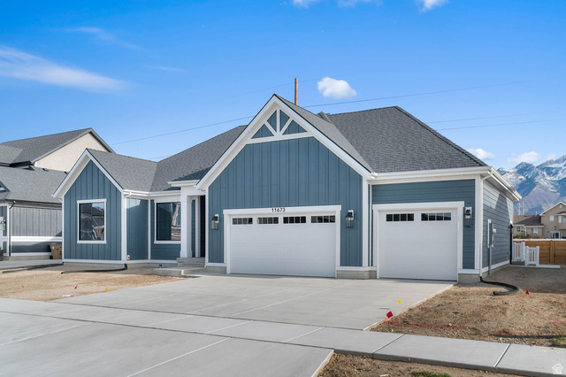 11673 South Halls Crk Road Draper, UT 84020 - Photo 2 of 22 Contemporary single-story residence featuring board and batten siding and a prominent gable roofline