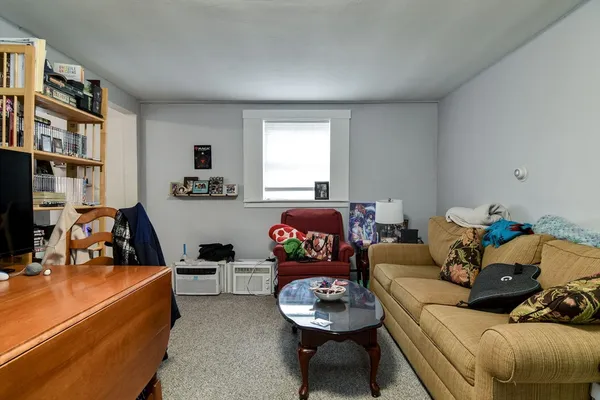 a living room with furniture and a couch