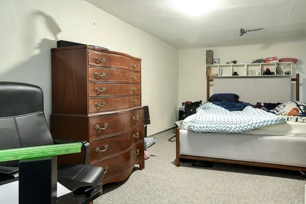 a bedroom with a bed and furniture
