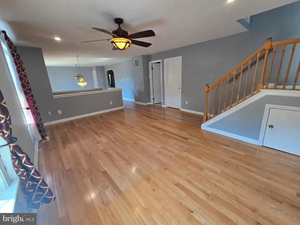 a view of an entryway with wooden floor