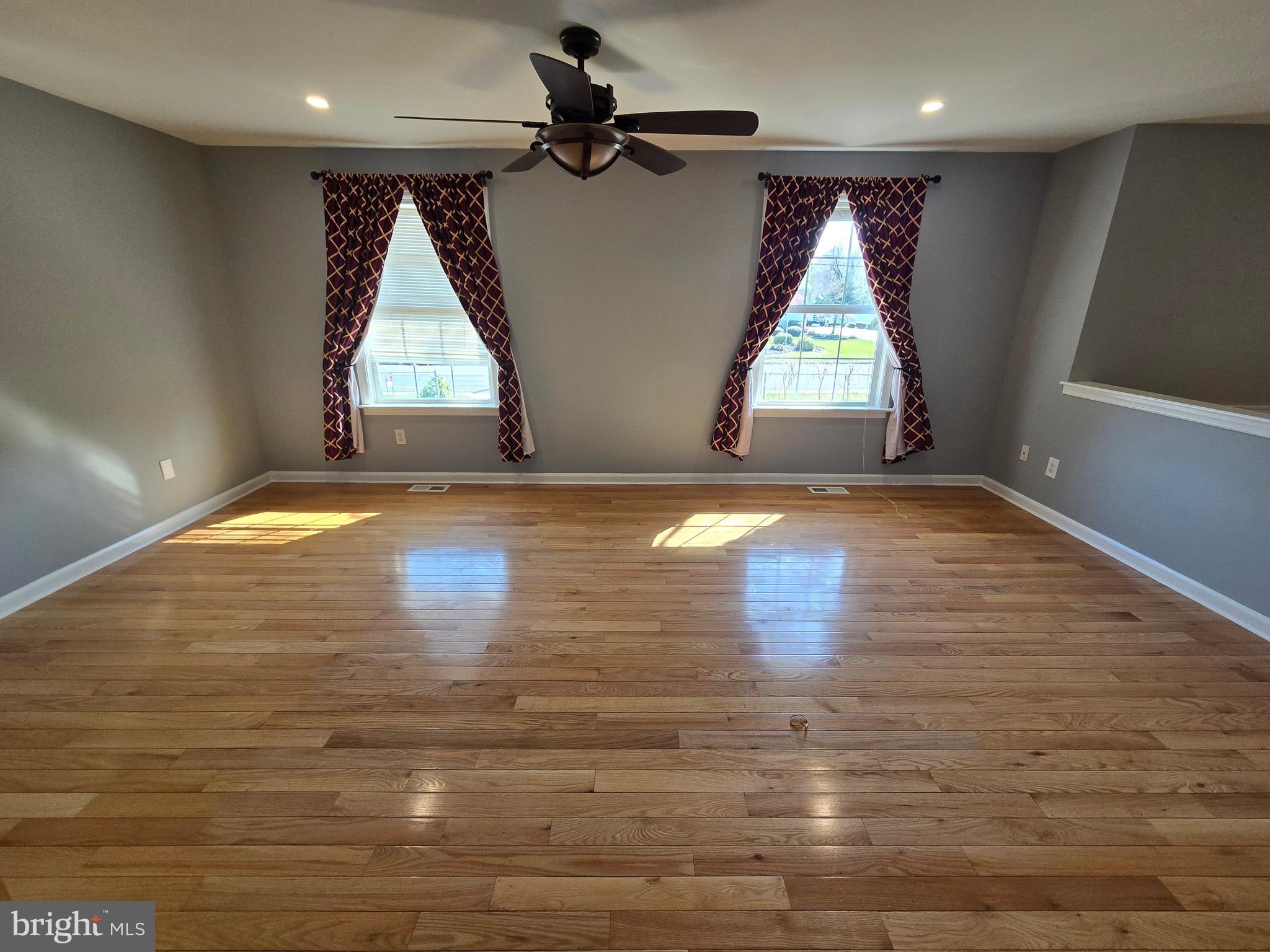 11 Hockamick Road Cookstown, NJ 08511 - Photo 2 of 45 a view of empty room with wooden floor and fan