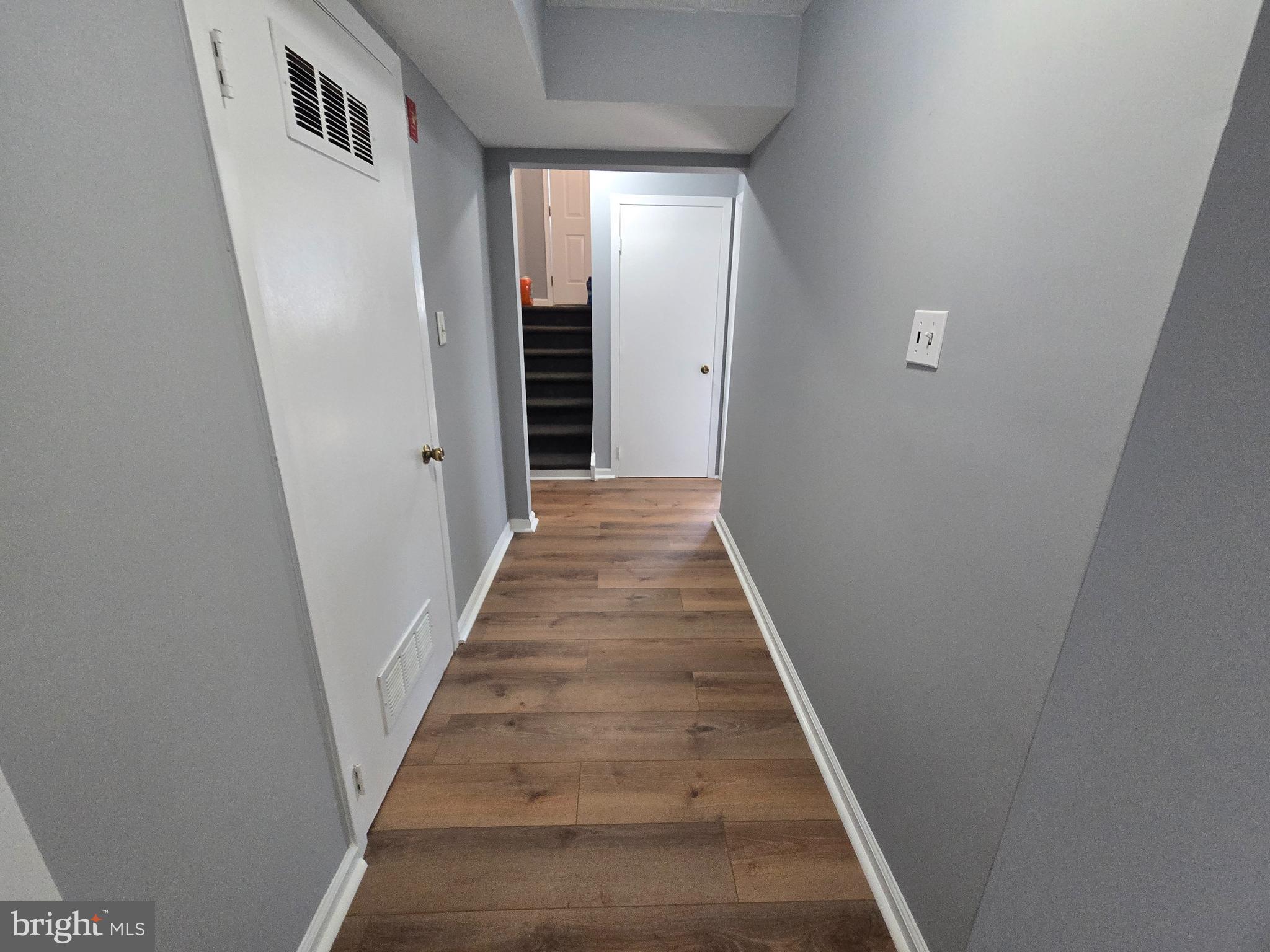 11 Hockamick Road Cookstown, NJ 08511 - Photo 22 of 45 a view of a hallway with wooden floor and entryway
