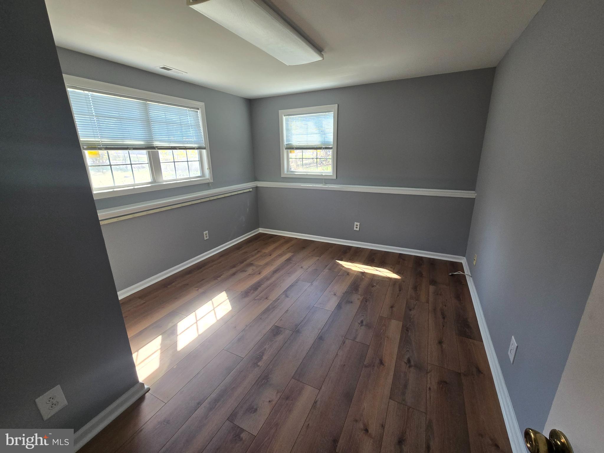 11 Hockamick Road Cookstown, NJ 08511 - Photo 24 of 45 wooden floor in an empty room with a window
