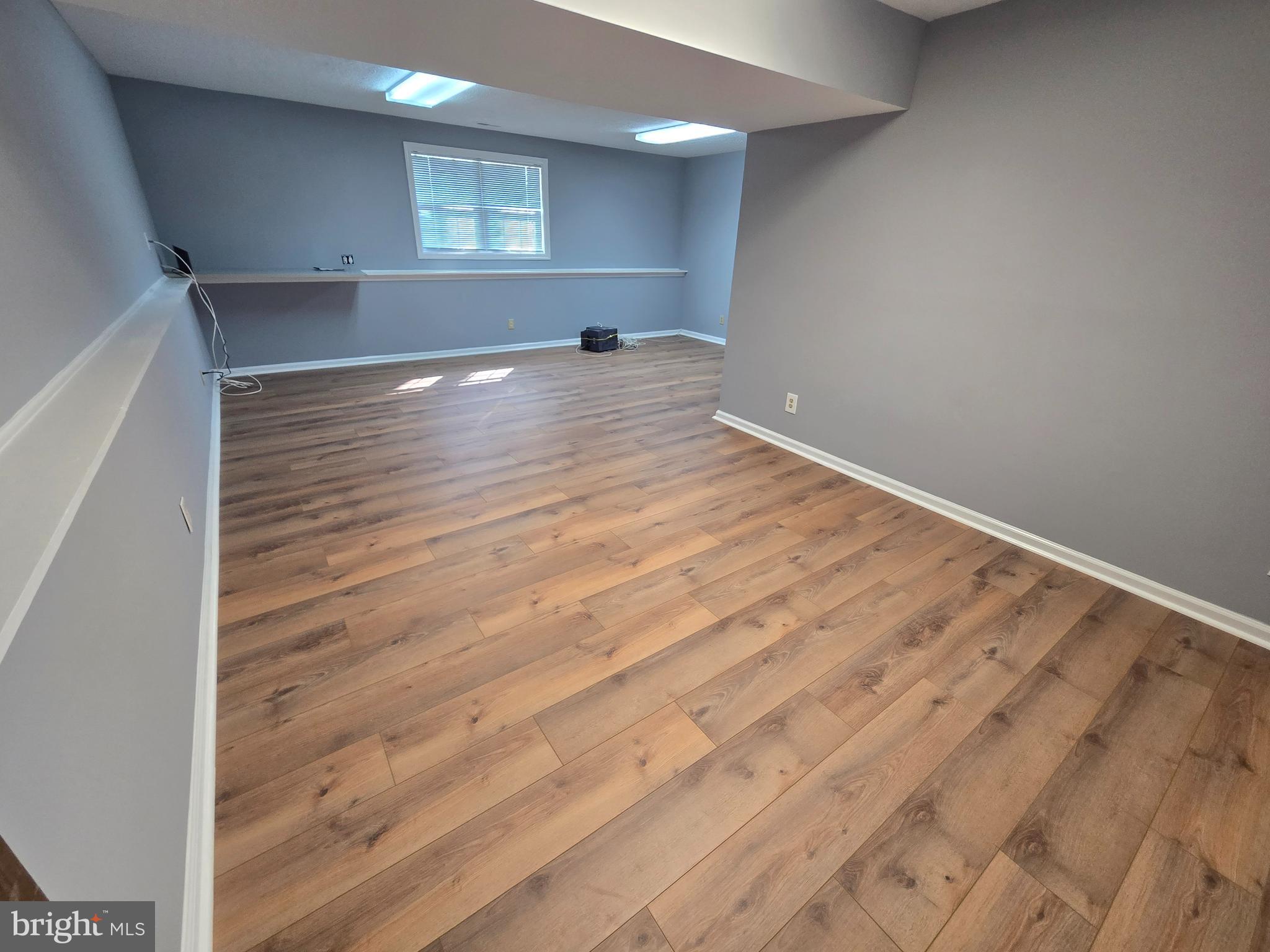 11 Hockamick Road Cookstown, NJ 08511 - Photo 30 of 45 an empty room with wooden floor and windows