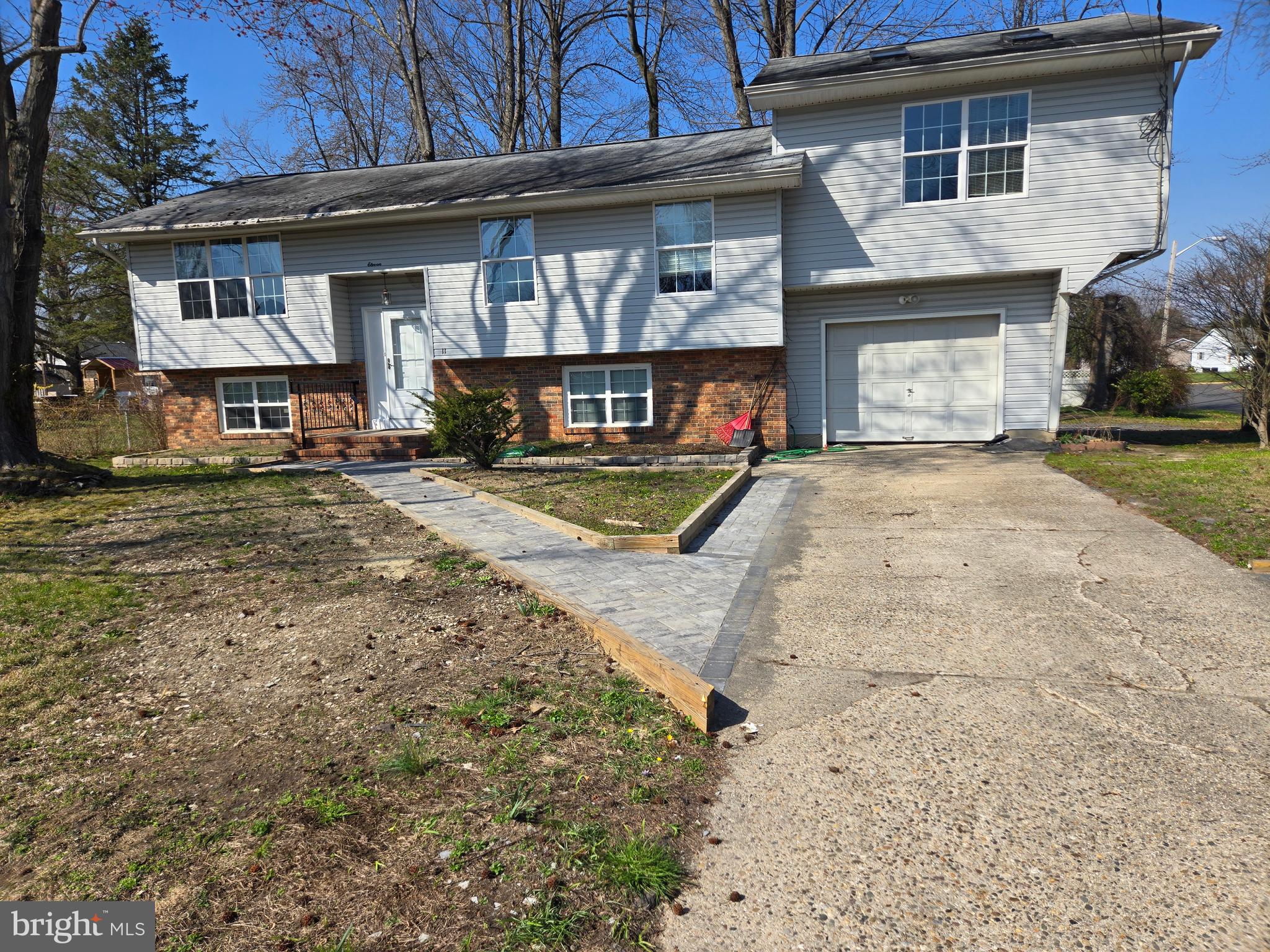 11 Hockamick Road Cookstown, NJ 08511 - Photo 38 of 45 a view of a house with a yard and garage