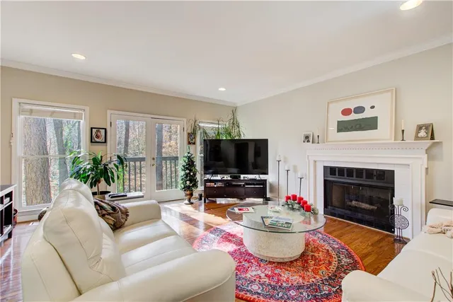 a bathroom with a sink mirror and tub