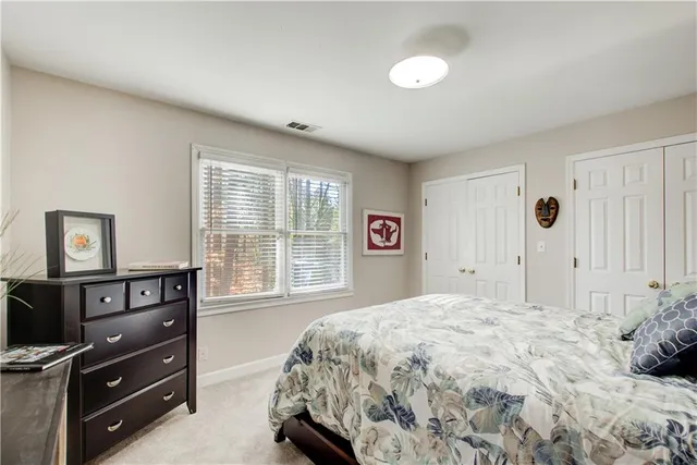 a bedroom with a bed and a television