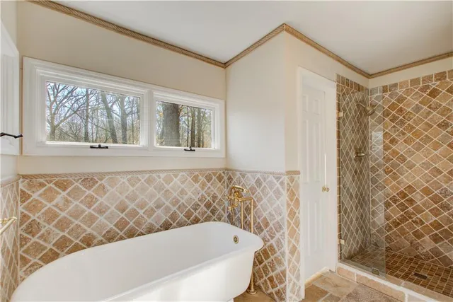 a bedroom with furniture and a ceiling fan