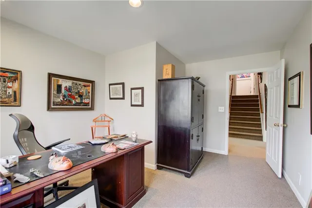 a room with gym equipment and a large window