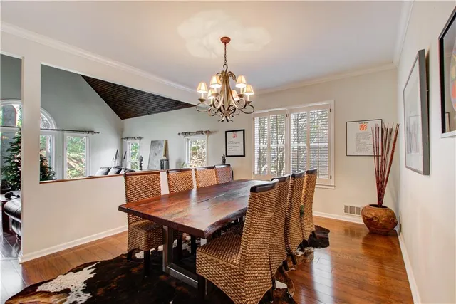 a kitchen with a stove a sink and a refrigerator
