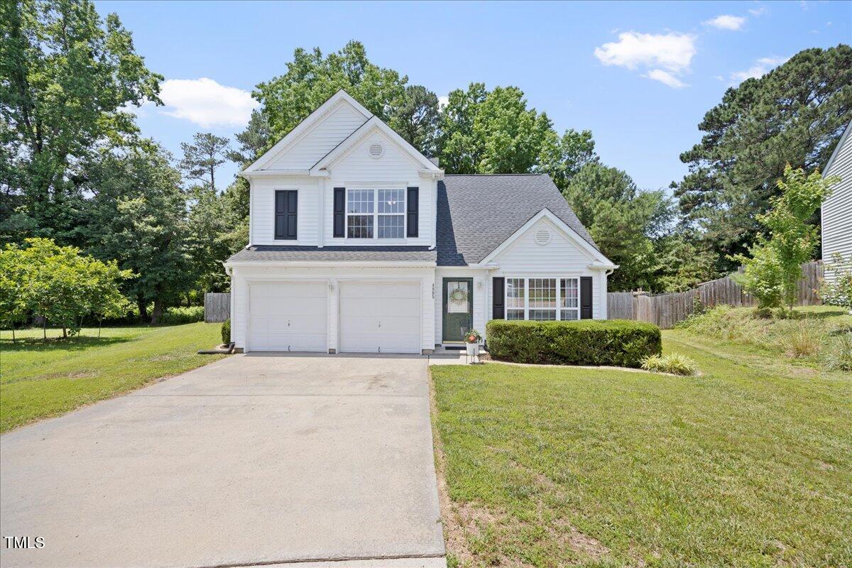 4805 Castle Crest Court Raleigh, NC 27616 - Photo 1 of 29 a front view of a house with yard and green space