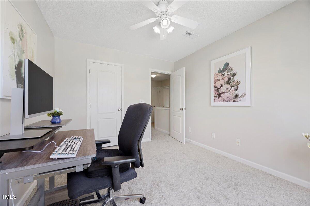 4805 Castle Crest Court Raleigh, NC 27616 - Photo 24 of 29 a view of workspace with wooden floor windows