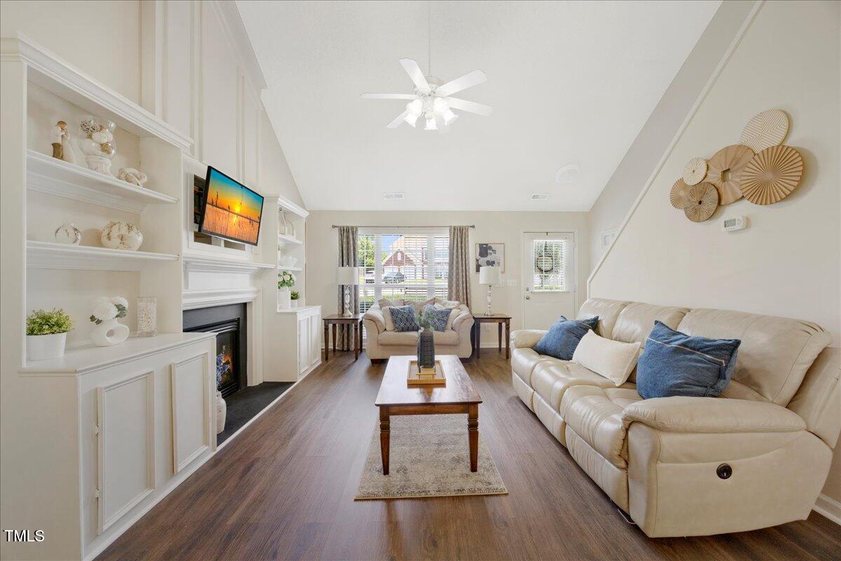 4805 Castle Crest Court Raleigh, NC 27616 - Photo 4 of 29 a living room with furniture fireplace and flat screen tv
