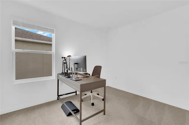 a work room with furniture and windows