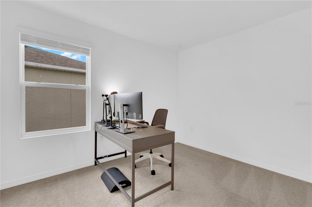 4226 Southern Vista Loop St. Cloud, FL 34772 - Photo 26 of 39 a view of a workspace with furniture