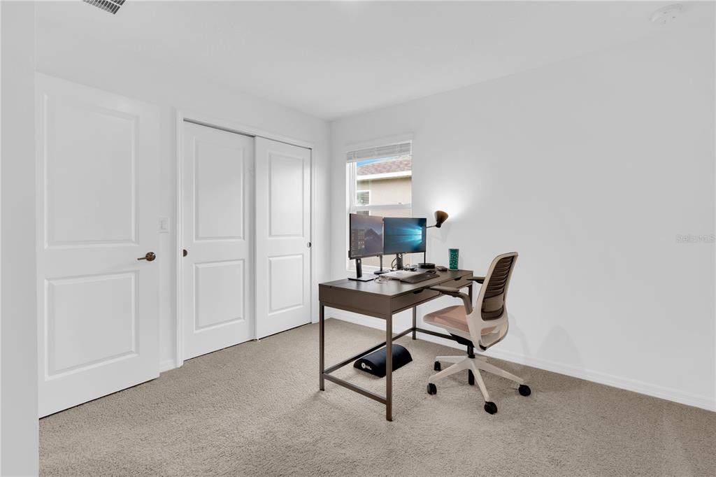 4226 Southern Vista Loop St. Cloud, FL 34772 - Photo 27 of 39 a work room with furniture and windows