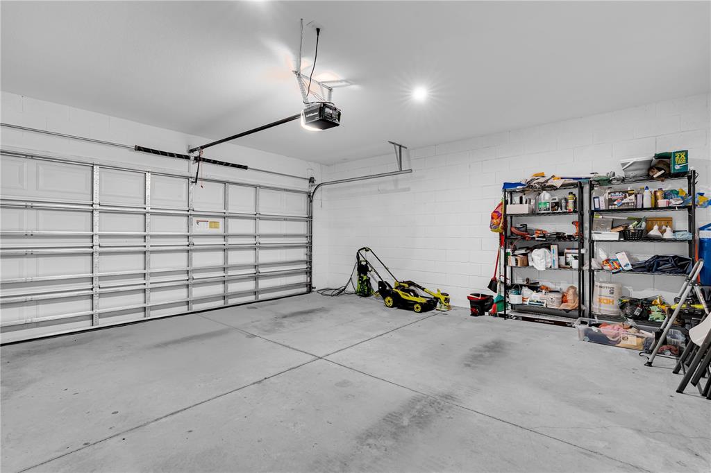 4226 Southern Vista Loop St. Cloud, FL 34772 - Photo 28 of 39 a view of a garage with gym equipment