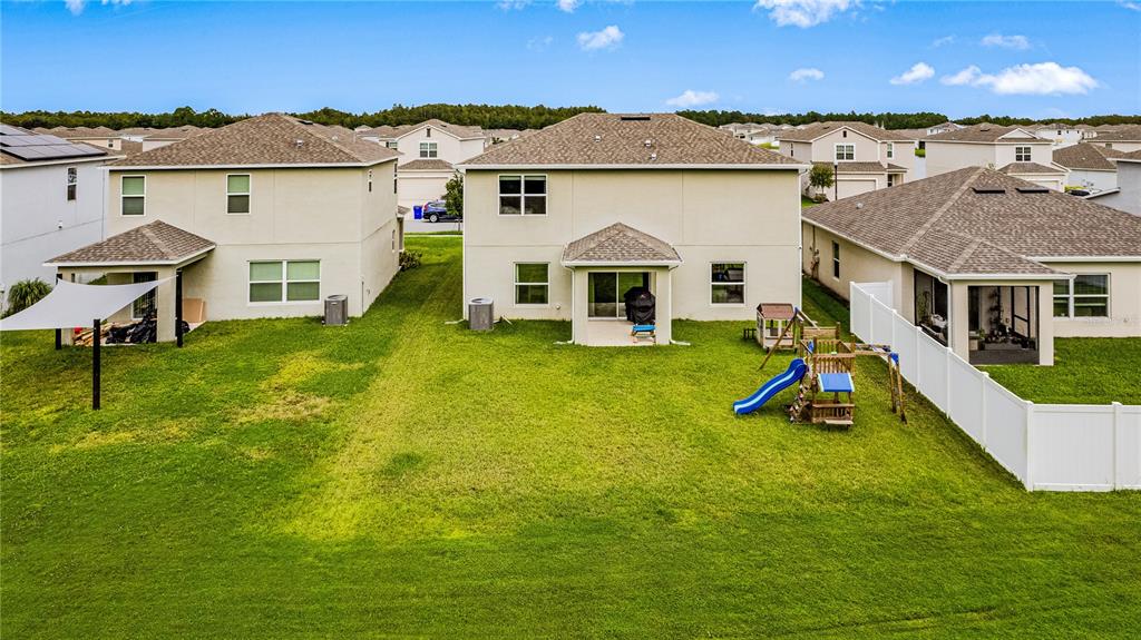 4226 Southern Vista Loop St. Cloud, FL 34772 - Photo 32 of 39 a view of a house with a yard and sitting area