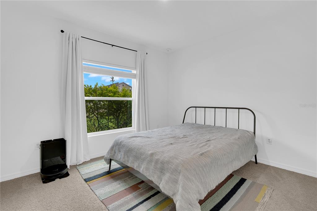 4226 Southern Vista Loop St. Cloud, FL 34772 - Photo 4 of 39 a bedroom with a bed and a window